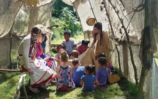 a group of people sitting outside