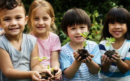 a group of children holding flowers