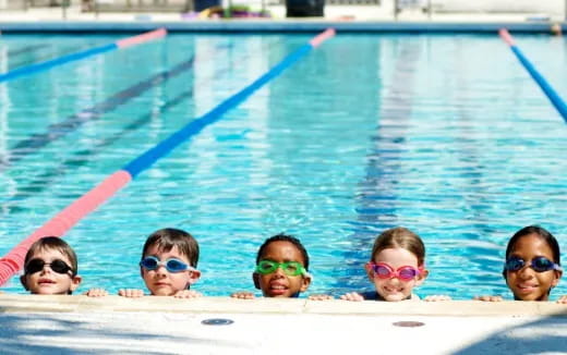 a group of kids in a pool