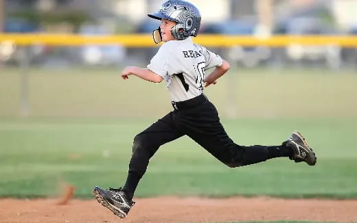 a young boy playing baseball