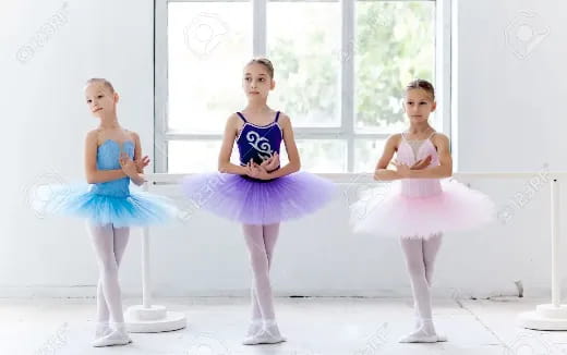 a group of women in dresses