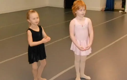two girls in dresses