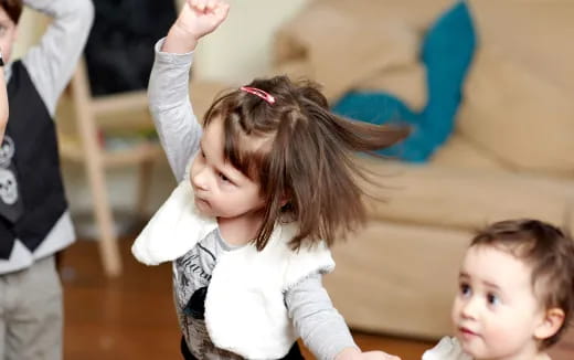 a girl holding a baby