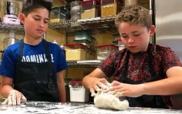 a couple of boys working on a project