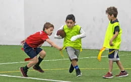 a group of boys playing football