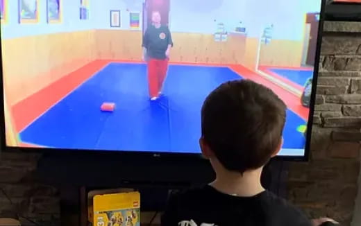 a boy playing pool