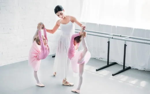 a person and two girls dancing