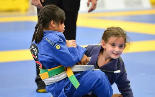 a couple of girls playing hockey
