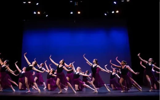 a group of women dancing on a stage