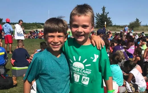 a couple of boys posing for the camera