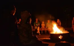 a group of people around a fire