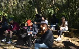a group of people sitting on a bench