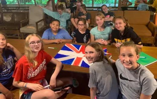 a group of people sitting at a table