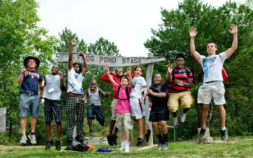 a group of people jumping in the air