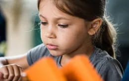 a young girl looking down