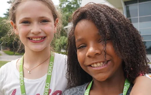 a couple of girls smiling