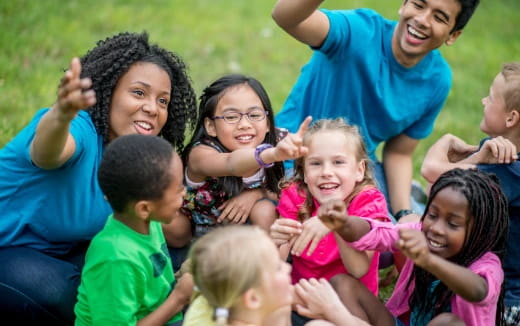 a group of people sitting together smiling
