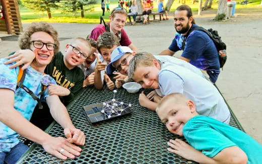 a group of people sitting on a table