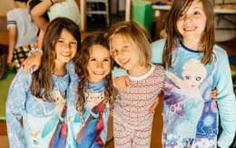 a group of girls posing for a photo