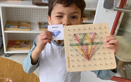 a boy holding a card