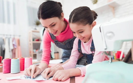 a person and a child looking at a book