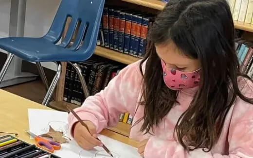 a girl with a mask on her face