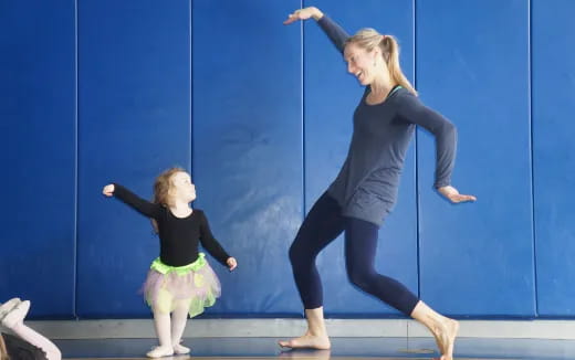 a woman and a girl dancing