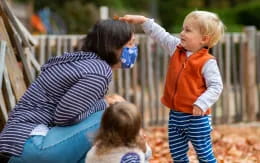 a person and children playing outside