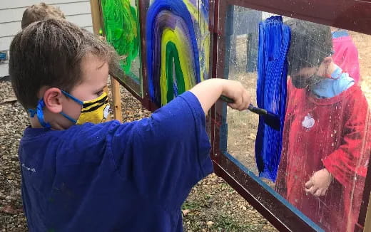a young boy painting