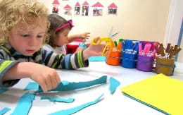 a couple of children painting