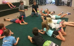 a group of people sitting on the floor