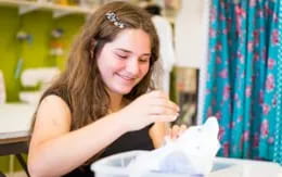 a woman holding a baby