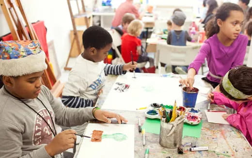 a group of children painting