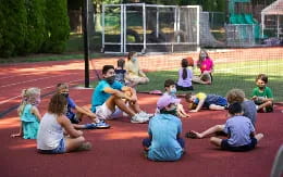 a group of people sitting on the ground