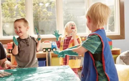 a group of children playing with toys