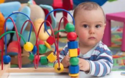 a baby playing with toys