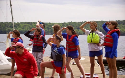 a group of people wearing life jackets