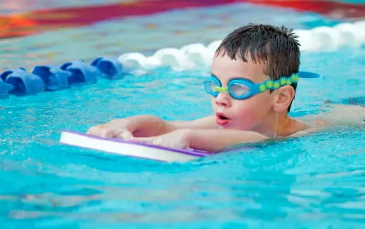 a baby in a pool