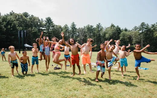 a group of people jumping in the air
