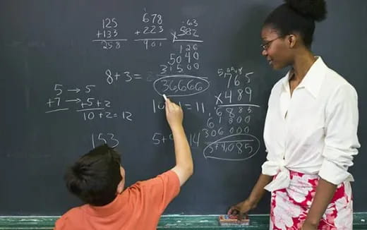 a teacher teaching a student