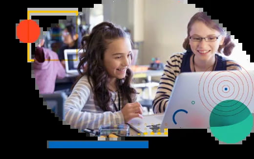 a woman and a girl looking at a computer screen