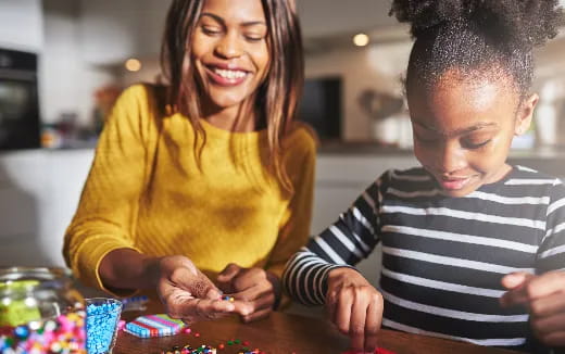 a person and a boy playing with toys
