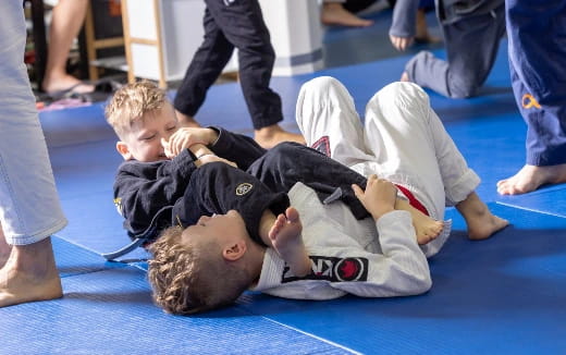 a person lying on another man