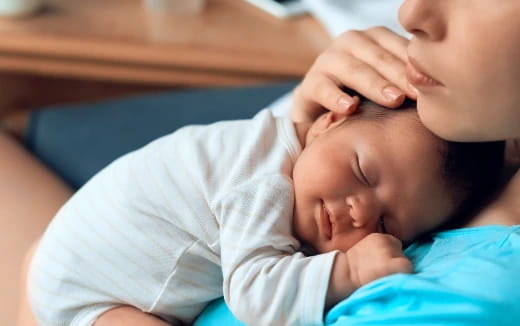 a person holding a baby