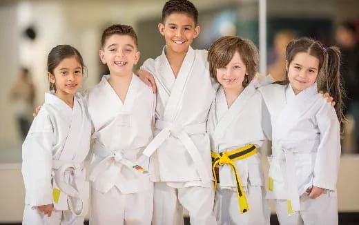 a group of children in white lab coats