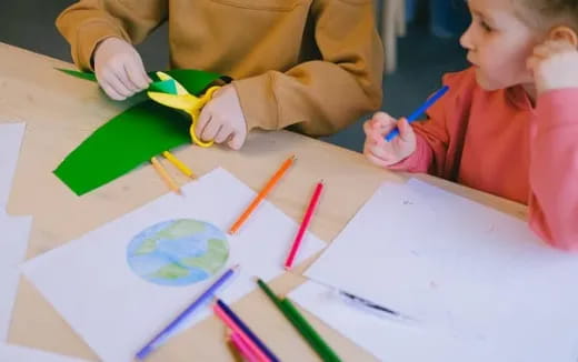 a child drawing on paper