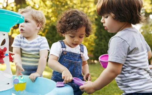 a group of children playing with toys