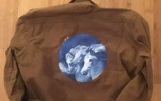 a blue rock on a brown surface