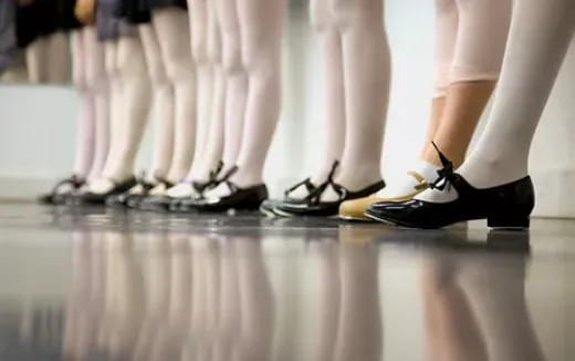 a group of people wearing black shoes