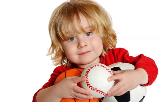 a child holding a football
